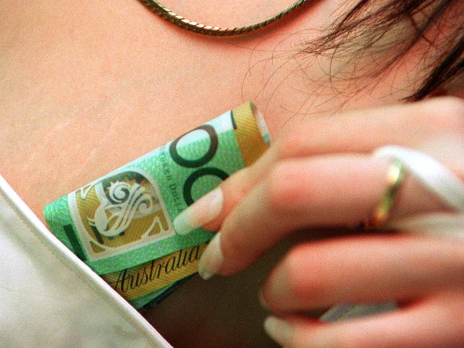 Prostitute sex worker holding money 21 Dec 1999.  / Prostitution industry archived