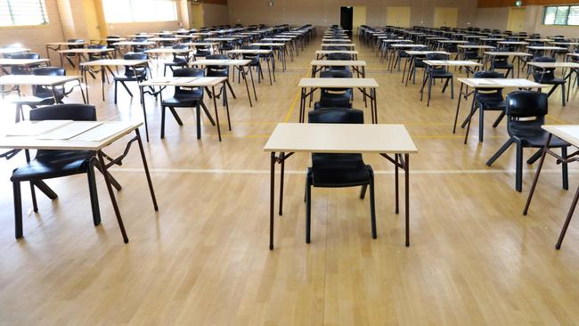 series of views of an examination hall or room images with exam tables set up ready for students. empty chairs and tables.   End of school exams university entrance or higher school certificate scene.