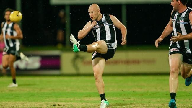 Gary Ablett Jr kicks forward for Palmerston on his return to the footy field. Picture: Glenn Campbell