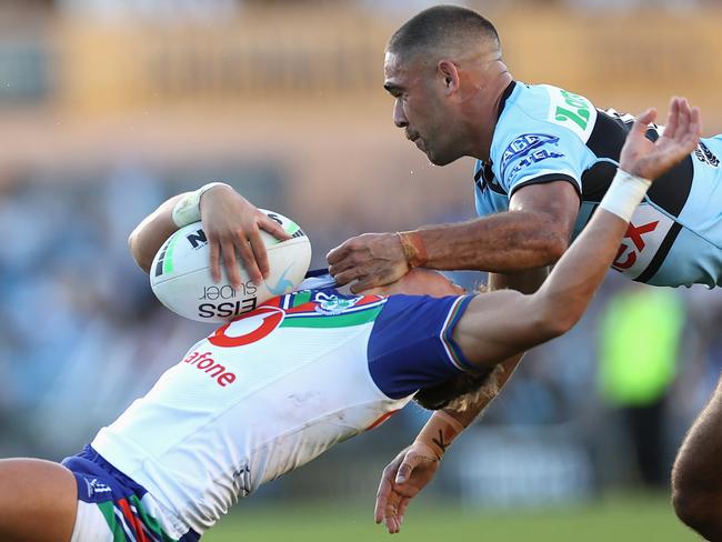 SYDNEY, AUSTRALIA - MAY 08: William Kennedy of the Sharks tackles Reece Walsh of the Warriors high during the round nine NRL match between the Cronulla Sharks and the New Zealand Warriors at PointsBet Stadium, on May 08, 2022, in Sydney, Australia. (Photo by Cameron Spencer/Getty Images)