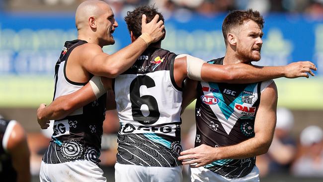 CELEBRATION TIME: Robbie Gray (right) celebrates a goal with Port Adelaide teammates Sam Powell-Pepper (left) and Steven Motlop against St Kilda in China last week. Picture: MICHAEL WILLSON (AFL Photos).