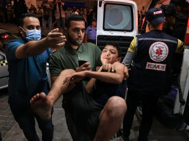 An injured boy is rushed to the emergency war of a hospital following an Israeli strike on Khan Yunis in the southern Gaza Strip. Picture: AFP