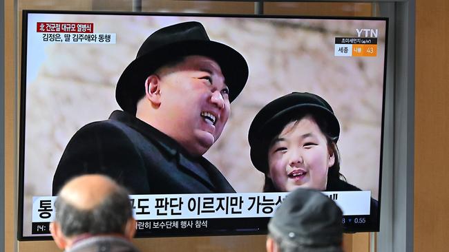 People watch a North Korean news broadcast featuring Mr Kim and his daughter. Picture: Jung Yeon-je/AFP