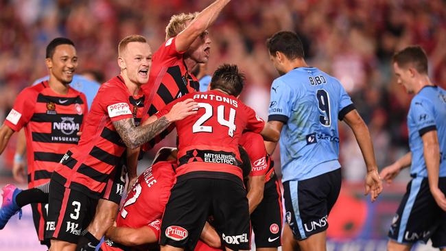 The Wanderers celebrate Brendan Santalabs opening goal.