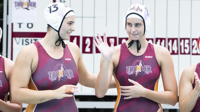 Alice Campbell, right, is introduced to the crowd at a recent Queensland Thunder match. On her right is Tenealle Fasala who made the same Australian youth squad. (AAP Image/Richard Walker)