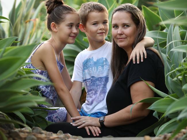 12/4/2018: South African-born photographer  Jacqui Simpson with her children, Connor and Jade, at their home in Cashmere, Brisbane.  Jacqui's mother, father and sister  are still living in South Africa - her father in Hermanus, where riots have broken out recently - and she fears for their safety. Lyndon Mechielsen/The Australian