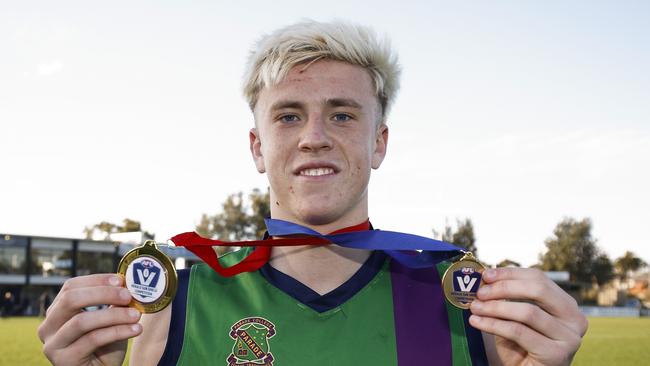 Nate Caddy with the best on ground and premiership medal for Parade College Picture: Getty Images