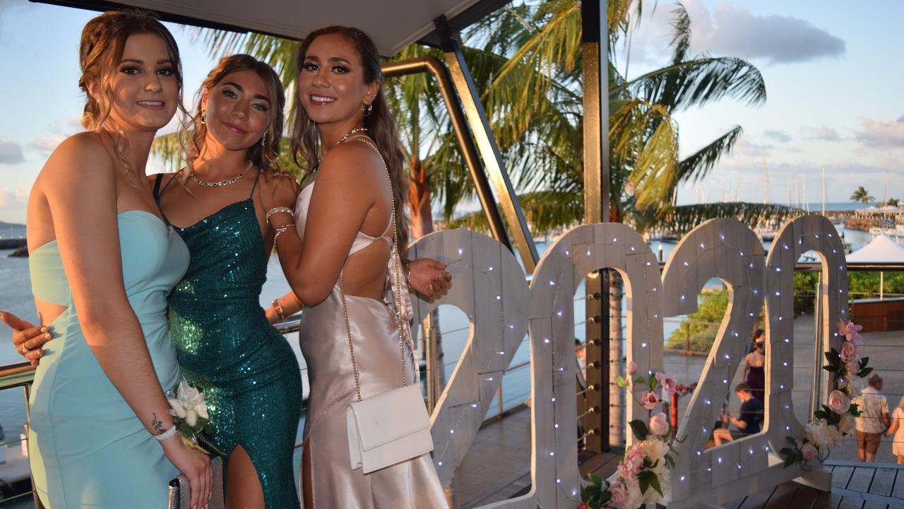 (From left) Latiesha Dalton, Isabel Davis and Segana Avery farewell 2020 in style at the 2020 St Catherine's Catholic College formal. Photo: Elyse Wurm