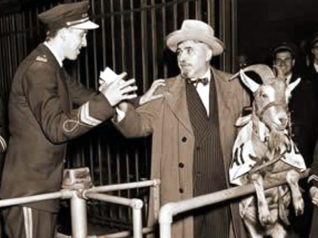 The origin of the “Billy Goat Curse” - Billy Goat Tavern owner William Sianis with his pet goat Murphy at Wrigley Field during the 1945 World Series.