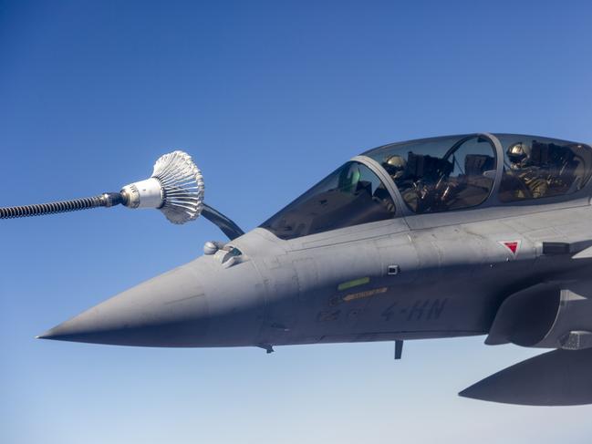 A French Rafale jet refuels mid-air about 100km south of Darwin. Picture: Floss Adams.