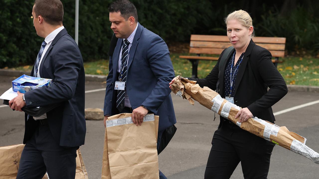 Police carry bagged evidence including a samurai sword from the trial of Blake Davis and Hannah Quinn at Darlinghurst, NSW. Picture: NCA NewsWire / Dylan Coker