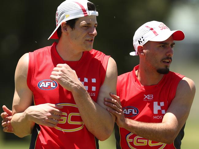 GOLD COAST, AUSTRALIA - NOVEMBER 26:  Chris Burgess and Izak Rankine during a Gold Coast Suns AFL training session on November 26, 2018 in Gold Coast, Australia.  (Photo by Chris Hyde/Getty Images)