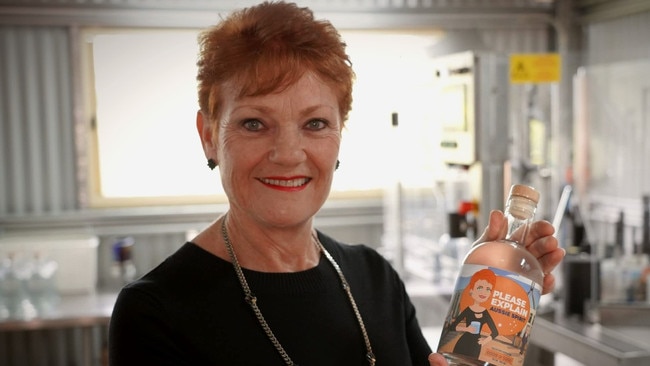 Pauline Hanson with a bottle of Please Explain Aussie Spirit.