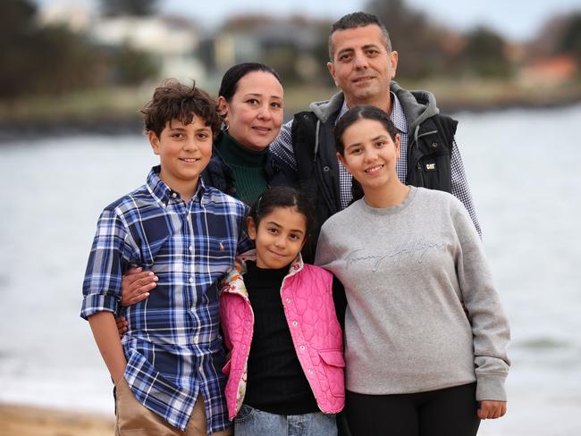 Weekend story about a dad Peter Ghobrial who inadvertently saved his own life while rescuing his daughter Natalie 14 from drowning at a Sorrento beach, after the frantic swim exposed a silent heart issue that would have likely killed him. Peter Ghobrial with wife Fiby, son Giovanni 12, daughters Celina 8 and Natalie 14.                                                               Picture: David Caird
