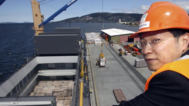 Tasmanian eucalypt veneer shipment from Ta Ann rotary veneer mill in the Huon Valley, Ta Ann manager Doctor (Dr) How Sing Sii watches as the veneer is loaded on the ship M/V Matsumae at Macquarie Wharf