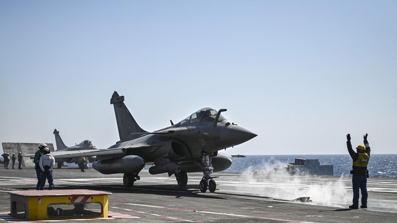 A Rafale fighter jet landing on the French aircraft carrier 'Charles de Gaulle' off Chania military base, Crete island. Picture Theophile Bloudanis / AFP)