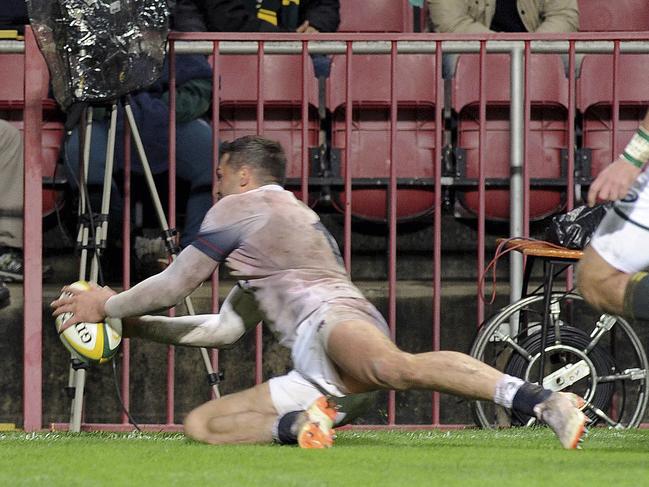 England's Jonny May scores a try during the third rugby test match between South Africa and England at Newlands in Cape Town, South Africa, Saturday, June 23, 2018. (AP Photo/Nasief Manie)