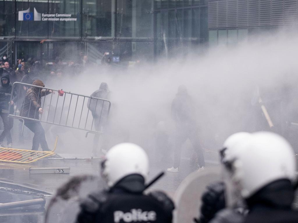 Protesters face off against the police during an anti-migrant demonstration outside of EU headquarters in Brussels. Picture: AP