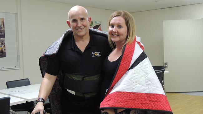 Mark Urquhart and partner Vikki Cooper with Mark's Quilt of Valour.