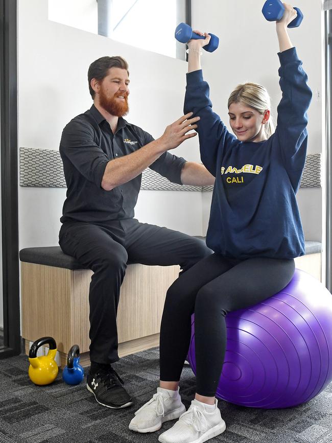 Holly with exercise physiologist Stephen Bateman during a recovery session. Picture: Tom Huntley