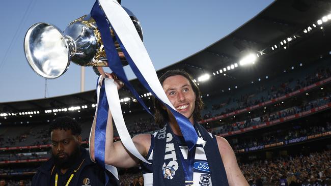 MELBOURNE, AUSTRALIA – SEPTEMBER 24: Jack Henry of the Cats holds aloft the premiership cup after winning the 2022 AFL Grand Final match between the Geelong Cats and the Sydney Swans at the Melbourne Cricket Ground on September 24, 2022 in Melbourne, Australia. (Photo by Daniel Pockett/AFL Photos/via Getty Images)