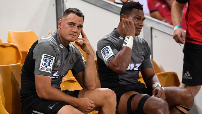 Crusaders stars Israel Dagg and Seta Tamanivalu nurse their injuries in Brisbane.