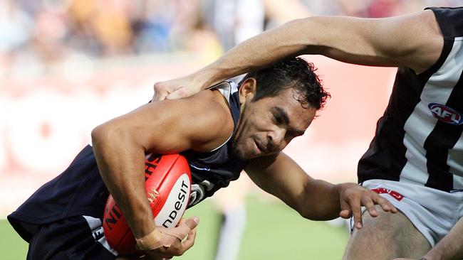 A fresh-faced Eddie Betts gets collared against Collingwood at the MCG in 2006.