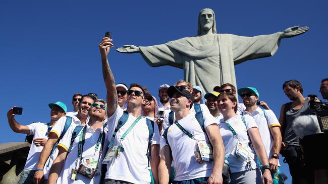 Members of the Australian men's hockey team pose in front of Christ the Redeemer at Corcovado Mountain ahead of the Games in Rio de Janeiro. Picture: AAP Image/Getty Images