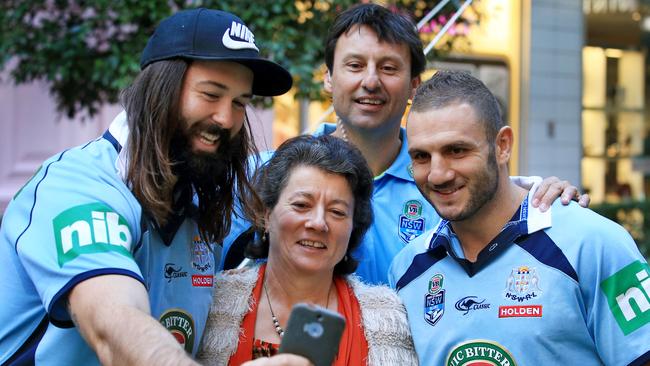 Aaron Woods, Laurie Daley and Robbie Farah with fan Yvonne Kendall at a VB Blues promotion. Picture: Mark Evans