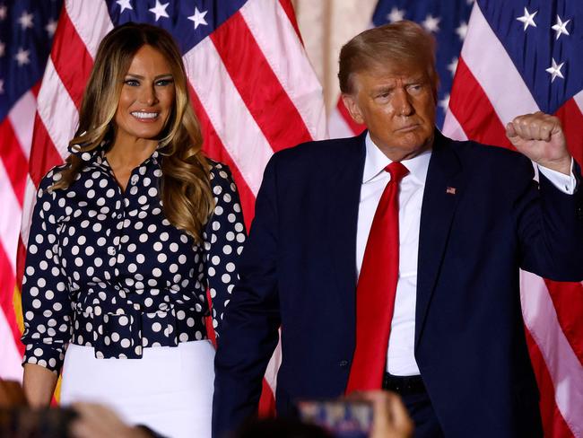 Former US President Donald Trump, joined by former US First Lady Melania Trump, arrives to speak at the Mar-a-Lago Club in Palm Beach, Florida, on November 15, 2022. - Donald Trump pulled the trigger on a third White House run on November 15, setting the stage for a bruising Republican nomination battle after a poor midterm election showing by his hand-picked candidates weakened his grip on the party. Trump filed his official candidacy papers with the US election authority moments before he was due to publicly announce his candidacy. (Photo by ALON SKUY / AFP)