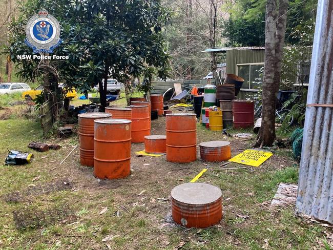 Barrels and signage seen in the camp.