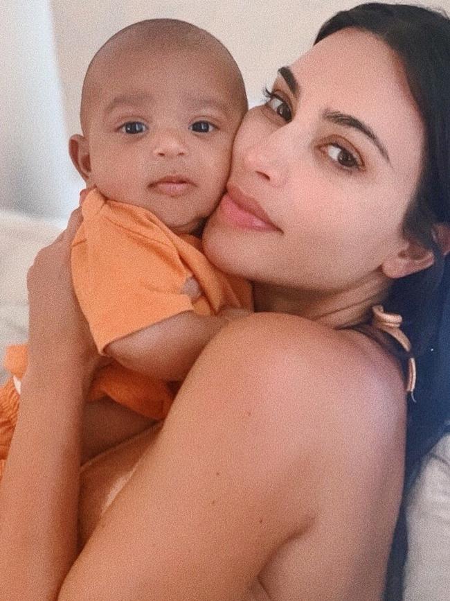 Kim Kardashian, right, welcomed her fourth child, named Psalm.