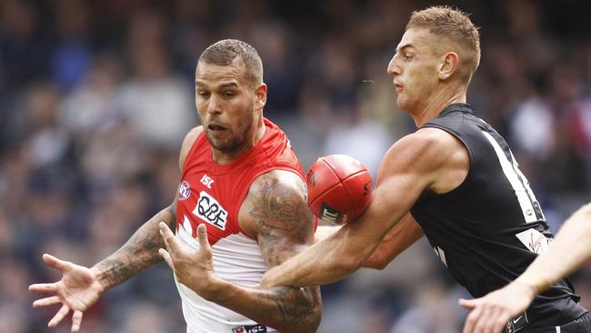 Liam Jones harasses Buudy Franklin on Saturday. Pic: AAP