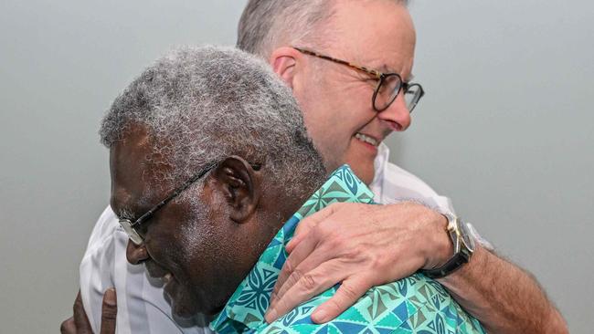 Anthony Albanese hugs Solomon Islands Prime Minister Manasseh Sogavare as they meet for a bilateral meeting at the Pacific Islands Forum last year. Picture: Joe Armao/AFP)