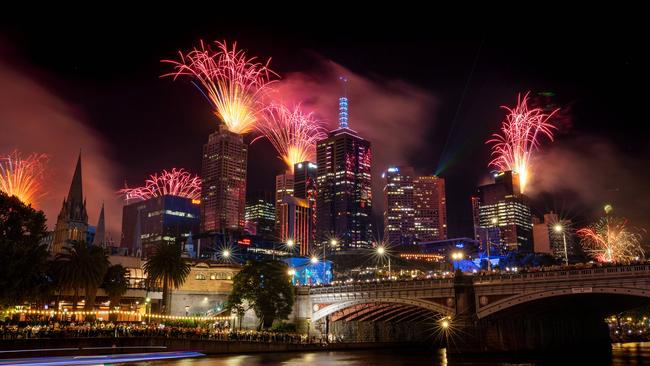 The Melbourne skyline lights up as the clock strikes midnight on New Year’s Eve. Picture: Mark Stewart