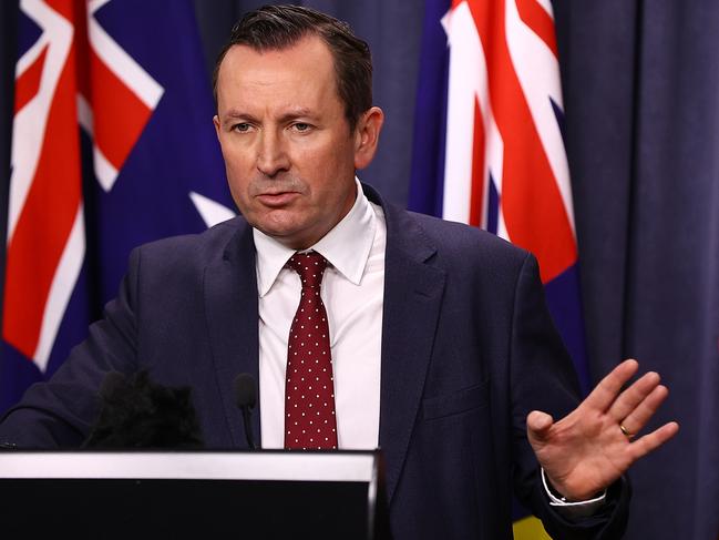 PERTH, AUSTRALIA - NOVEMBER 13: WA Premier Mark McGowan addresses the media with a COVID-19 update on November 13, 2020 in Perth, Australia. Western Australia's borders will reopen from midnight tonight with travellers from all states and territories permitted to enter WA having to meet exemption criteria put in place during the height of the COVID-19 pandemic in Australia. Travellers from Victoria and New South Wales will be required to self-quarantine for 14 days and take a COVID-19 test on day 11, while all other travellers will be required to undergo a health screening and temperature check on arrival and declare they haven't come from Victoria or NSW. Travel arrangements also need to be registered on the G2G Pass app.  (Photo by Paul Kane/Getty Images)