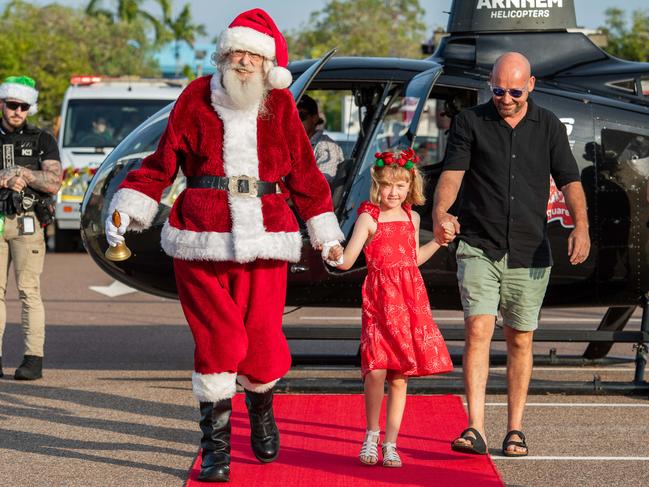 Dozens of excited children and parents watched Santa's with Brooklyn Fairfield and Mick Fairfield spectacular arrival at Casuarina Square. Picture: Pema Tamang Pakhrin.