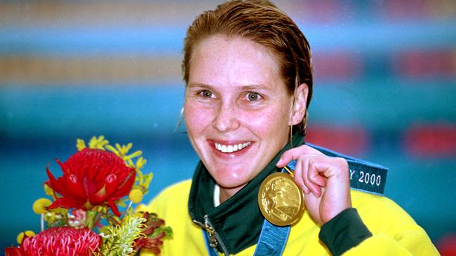 Susie O’Neill with her gold medal. Picture: Stu Forster