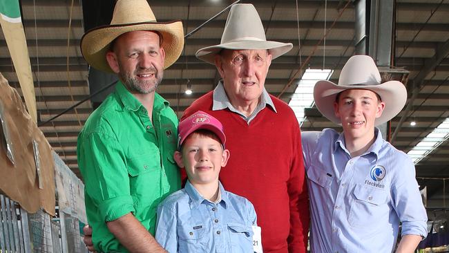 Carl, George, 8, Colin, 91, and Angus, 15, of Tennysonvale Simmental Fleckvieh stud at the Melbourne Royal Show cattle competition. Picture: Conor Fowler