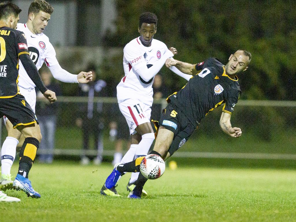 Bruce Kamau (centre) has joined Melbourne Victory. Picture: AAP Image/Tony McDonough