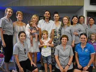 Braxton and his family with the organisers of his auction, the staff from Goodstart Early Learning. Picture: Ebony Graveur