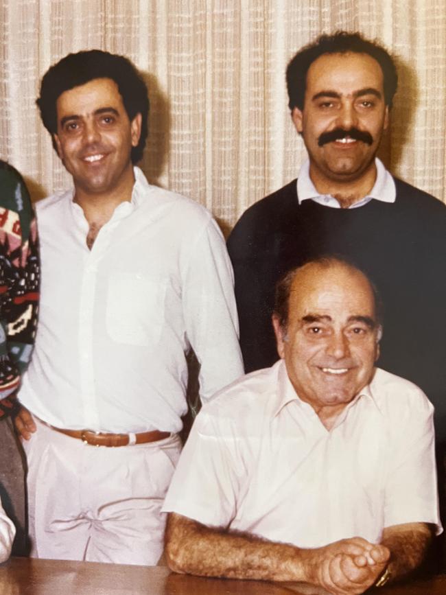 Michael Angelakis, left, with brother Nick and their father George. Supplied