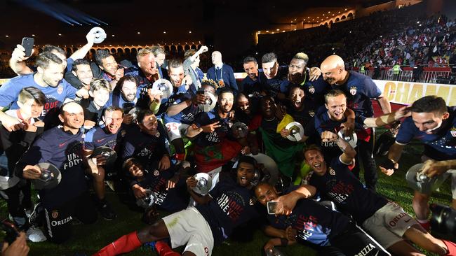 Monaco players celebrate.
