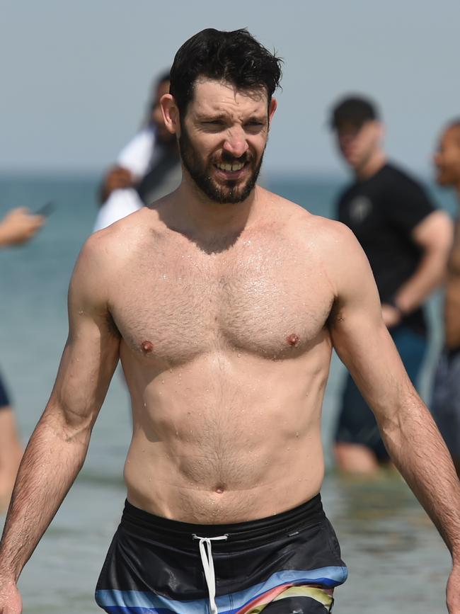 Kevin White goes for a dip in the ocean. Picture: Tricia Watkinson