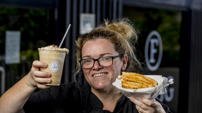 Frigg Cafe at Labrador for Your Local Takeaway profile. Toula Scott holding a Cheesy Cheese Toastie. Picture: Jerad Williams