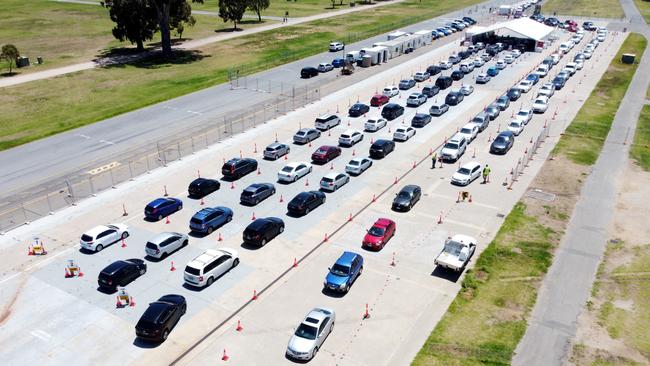 Cars queue for the COVID-19 testing facility at Victoria Park, just outside the Adelaide CBD, on Monday. Picture: Kelly Barnes/Getty Images