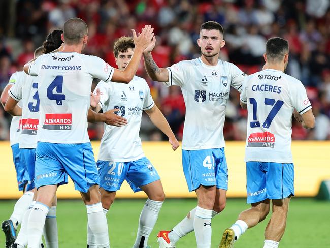 ADELAIDE, AUSTRALIA - DECEMBER 20: Alexandar Popovic of Sydney FC congratulates Jordan Courtney-Perkins of Sydney FC on his goal during the round nine A-League Men match between Adelaide United and Sydney FC at Coopers Stadium, on December 20, 2024, in Adelaide, Australia. (Photo by Sarah Reed/Getty Images)