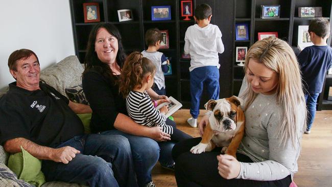 Foster families come in all shapes and sizes. Foster carers Peter and Fiona Milton with daughter Jasmine Foster, dog Forrest and their foster children earlier this month. (Pic: Carmela Roche/AAP)