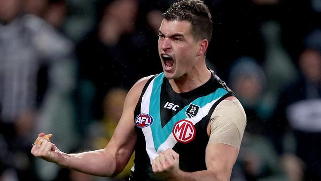 ADELAIDE, AUSTRALIA - AUGUST 08: Tom Rockliff of the Power celebrates a goal during the 2020 AFL Round 11 match between the Port Adelaide Power and the Richmond Tigers at Adelaide Oval on August 08, 2020 in Adelaide, Australia. (Photo by James Elsby/AFL Photos via Getty Images)