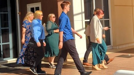 Samara Laverty (centre, green dress) and her supporters leave the Supreme Court after day one of Keith Kerinauia 's murder trial. Picture: Alex Treacy